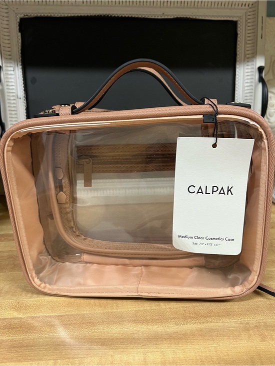 Calpak Handbags - Calpak NWT Clear Cosmetic Case in Beige/Tan with Top Handle